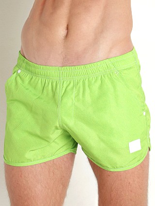 Model in green Modus Vivendi Jeans Jogging Cut Swim Shorts