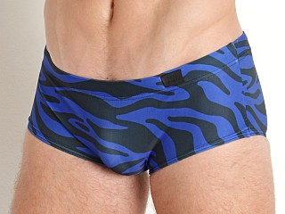 Model in blue Modus Vivendi Tiger Brazil Cut Swim Trunk