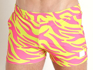 Model in yellow neon Modus Vivendi Tiger Swim Shorts