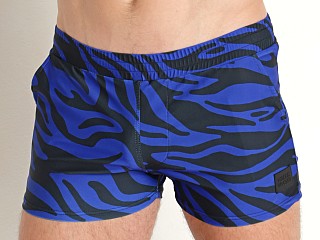 Model in blue Modus Vivendi Tiger Swim Shorts