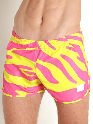 Model in yellow neon Modus Vivendi Tiger Jogging Cut Swim Shorts