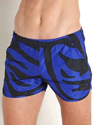 Model in blue Modus Vivendi Tiger Jogging Cut Swim Shorts