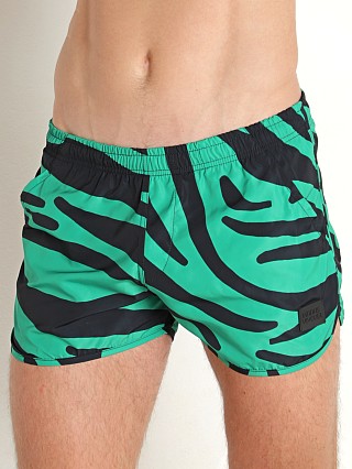 Model in green Modus Vivendi Tiger Jogging Cut Swim Shorts