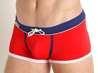 Model in red TOF Paris Holidays Swim Trunks