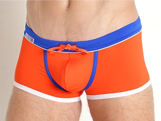 Model in orange TOF Paris Holidays Swim Trunks