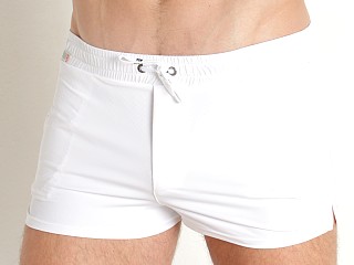 Model in white TOF Paris Holidays Swim Shorts