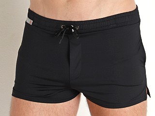 Model in black TOF Paris Holidays Swim Shorts