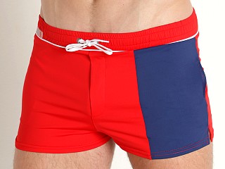 Model in red TOF Paris Holidays Swim Shorts