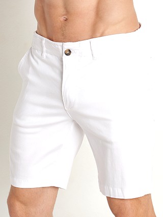 Model in white Benson Stretch Cotton Como Shorts