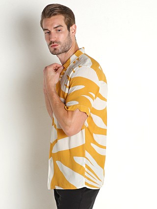 Model in yellow print Benson Rosseau Short Sleeve Shirt