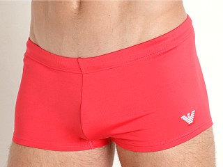 Model in coral Emporio Armani Essential Low Swim Trunk