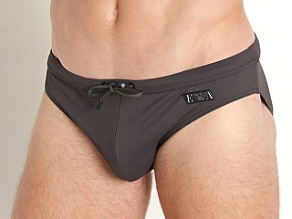 Model in dark land Emporio Armani Black Label Pique Low Swim Brief