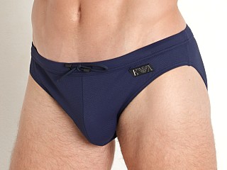 Model in navy blue Emporio Armani Black Label Pique Low Swim Brief