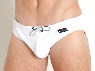 Model in white Emporio Armani Black Label Pique Low Swim Brief