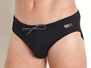 Model in black Emporio Armani  Label Pique Swim Brief