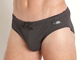 Model in dark land Emporio Armani Black Label Pique Swim Brief