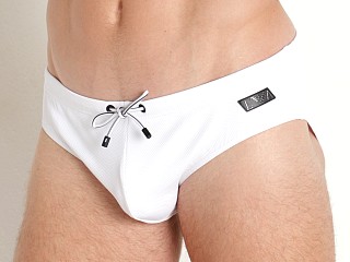 Model in white Emporio Armani Black Label Pique Swim Brief