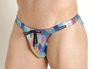 Model in parrot print Manstore Beach Club Shiny Micro Tanga Swim Brief