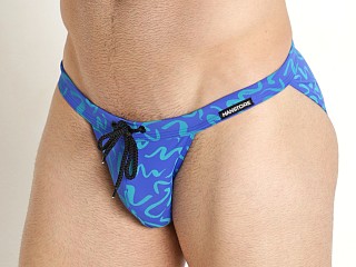 Model in blue print Manstore Beach Club Micro Tanga Swim Brief