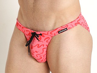 Model in red print Manstore Beach Club Micro Tanga Swim Brief