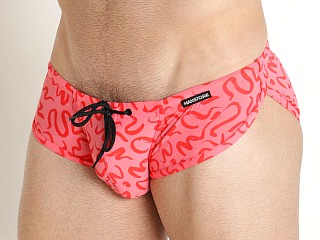 Model in red print Manstore Beach Club Sprint Swim Brief