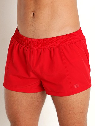 Model in red Nasty Pig Core Square Cut Swim Shorts