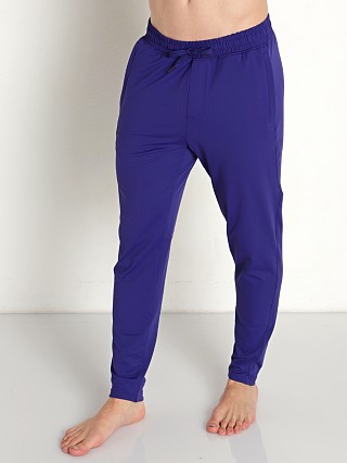 Model in sonar blue Under Armour Meridian Tapered Pants