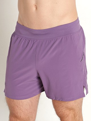 Model in retro purple/reflective Under Armour Launch Elite 5'' Short