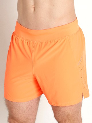 Model in orange blast/reflective Under Armour Launch Elite 5'' Short