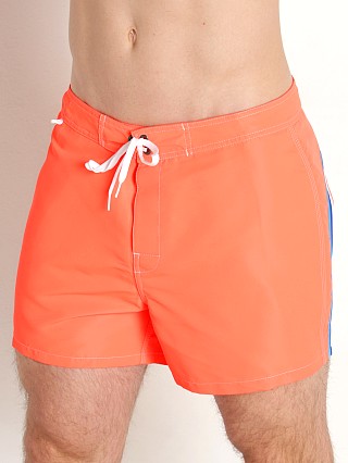 Model in fluo orange Sundek 14" Classic Low-Rise Boardshort