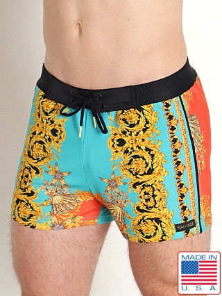 Model in jade/coral Sauvage Italian Print Swim Trunk