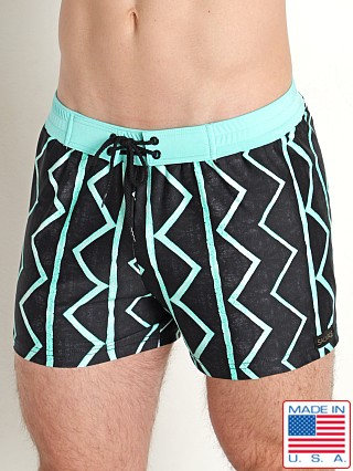 Model in blue/black geometric Sauvage Italian Lycra Printed Swim Trunk