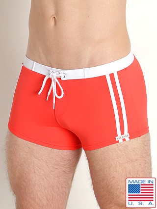 Model in coral Sauvage Riviera Swim Short