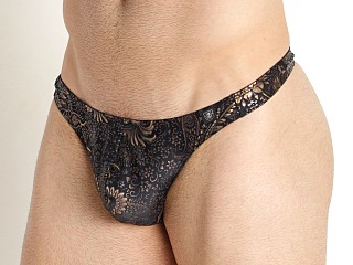 Model in gold TOF Paris Splendid Swim Thong