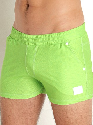 Model in green Modus Vivendi Jeans Swim Shorts