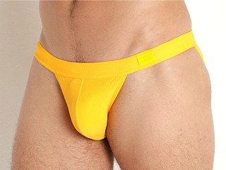 Model in yellow Modus Vivendi Towel Tanga Swim Brief