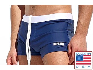 Model in navy Rufskin Bautista Square Cut Swim Trunk