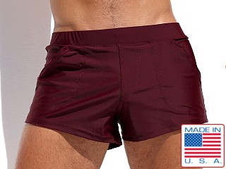 Model in mahogany Rufskin Macario Square Cut Swim Trunk