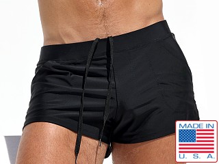 Model in matte black Rufskin Macario Square Cut Swim Trunk