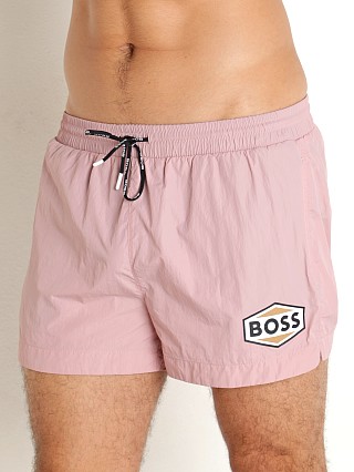 Model in pastel pink Hugo Boss Pacific Swim Shorts