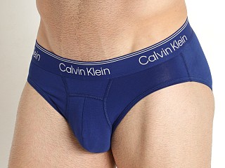 Model in dark sapphire Calvin Klein Athletic Active Hip Brief