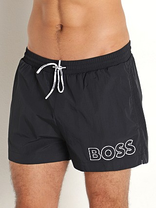 Model in black Hugo Boss Mooneye Swim Shorts