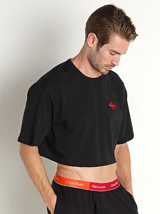 Model in black Calvin Klein Pride Lounge Crop Top