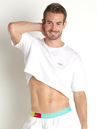 Model in white Calvin Klein Pride Lounge Crop Top