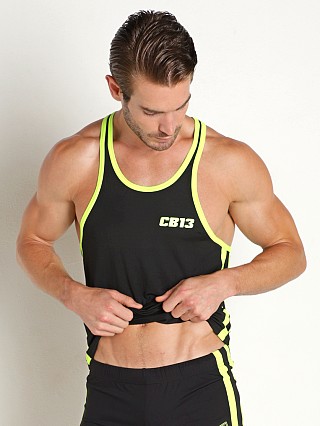 Model in yellow Cell Block 13 Baseline Tank Top