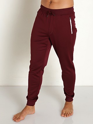 Model in dark maroon Under Armour Sportstyle Joggers