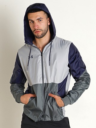 Model in midnight navy Under Armour Legacy Team Windbreaker