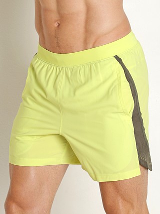 Model in lime yellow/reflective Under Armour Launch 5" Running Short