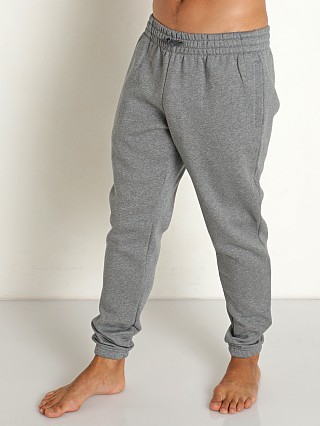 Model in grey heather Under Armour Essential Fleece Joggers