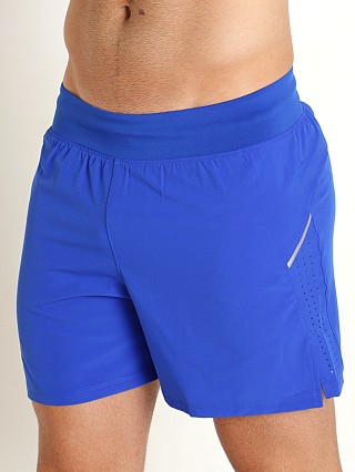 Model in team royal/reflective Under Armour Launch Elite 5" Short